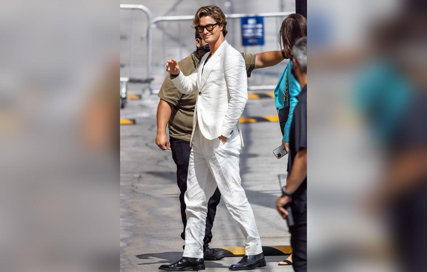 chase stokes arriving at jimmy kimmel live white suit