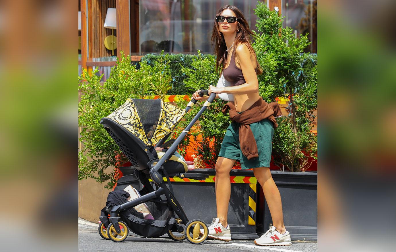 emily ratajkowski is all smiling while carrying her baby as they taking a stroll with husband sebastian bear mcclard in nyc