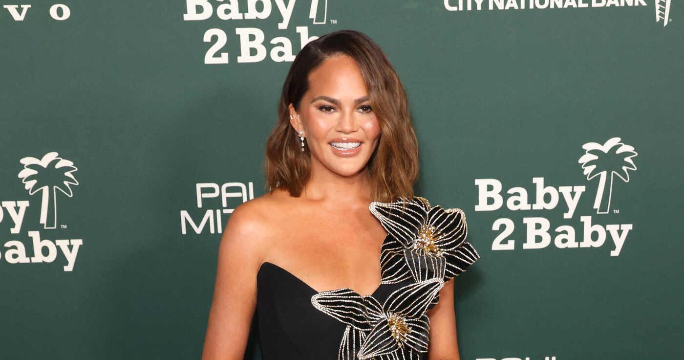 chrissy teigen dividing time kids