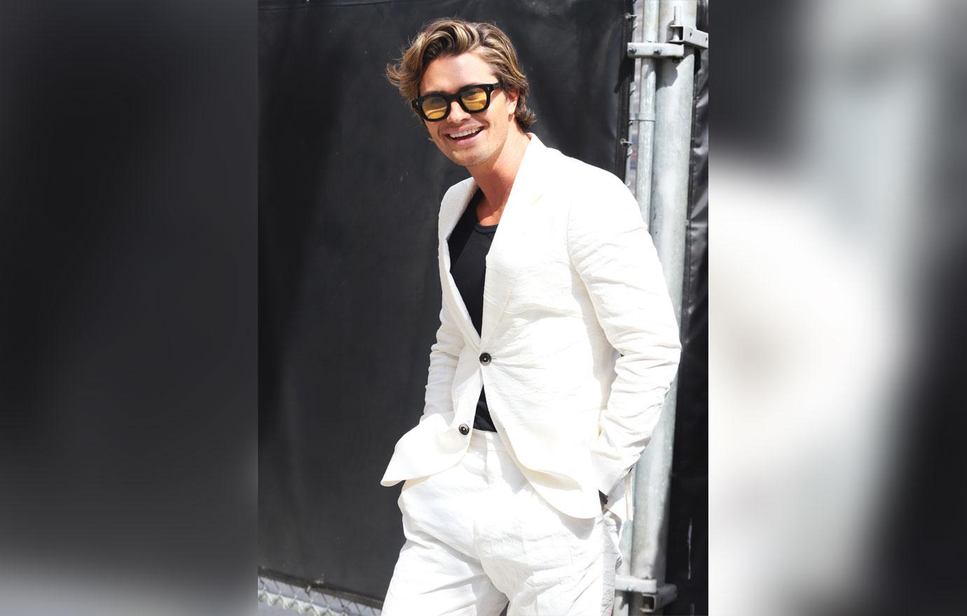 chase stokes arriving at jimmy kimmel live white suit