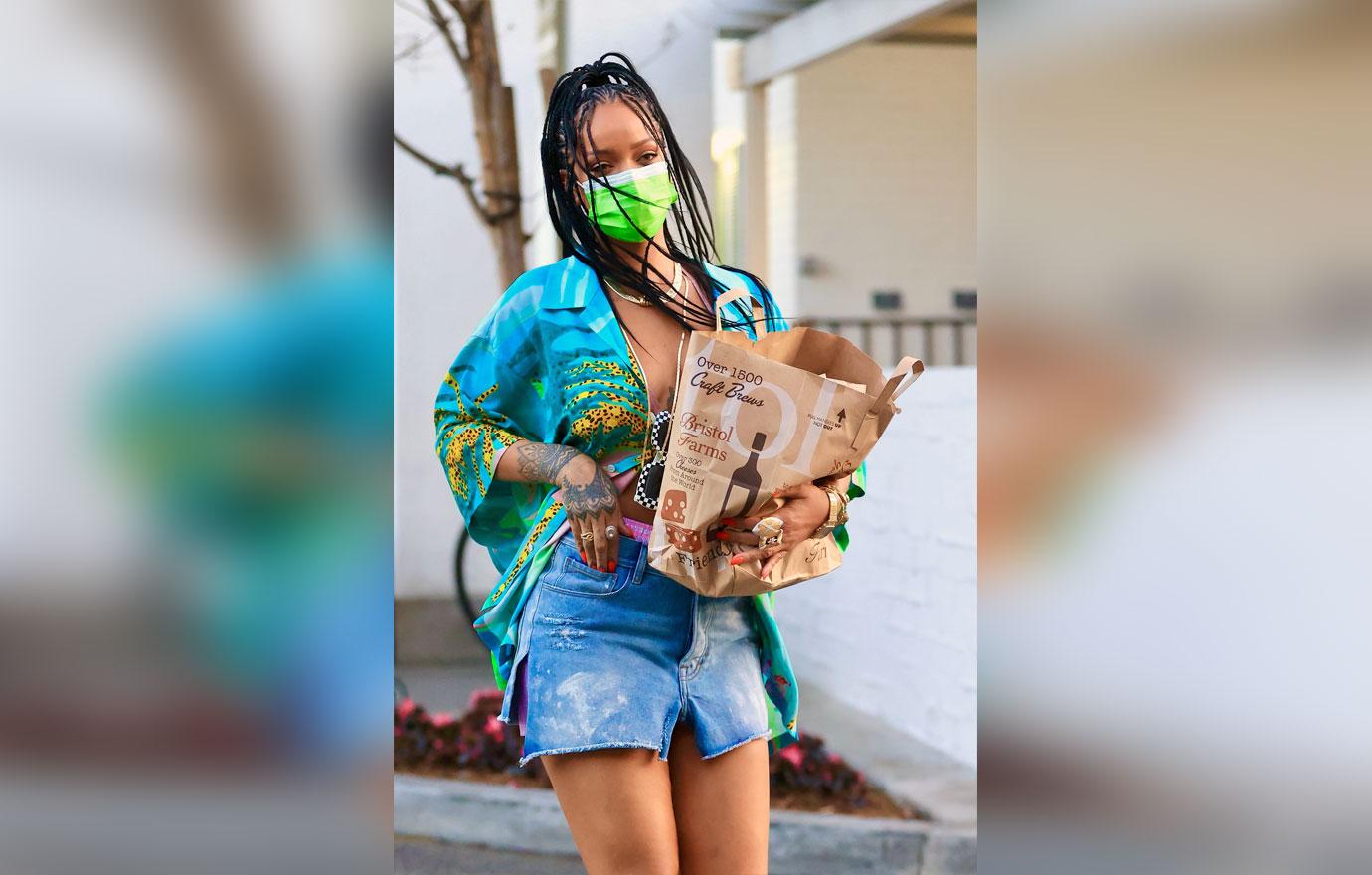 rihanna wears a bright outfit as she picks up groceries