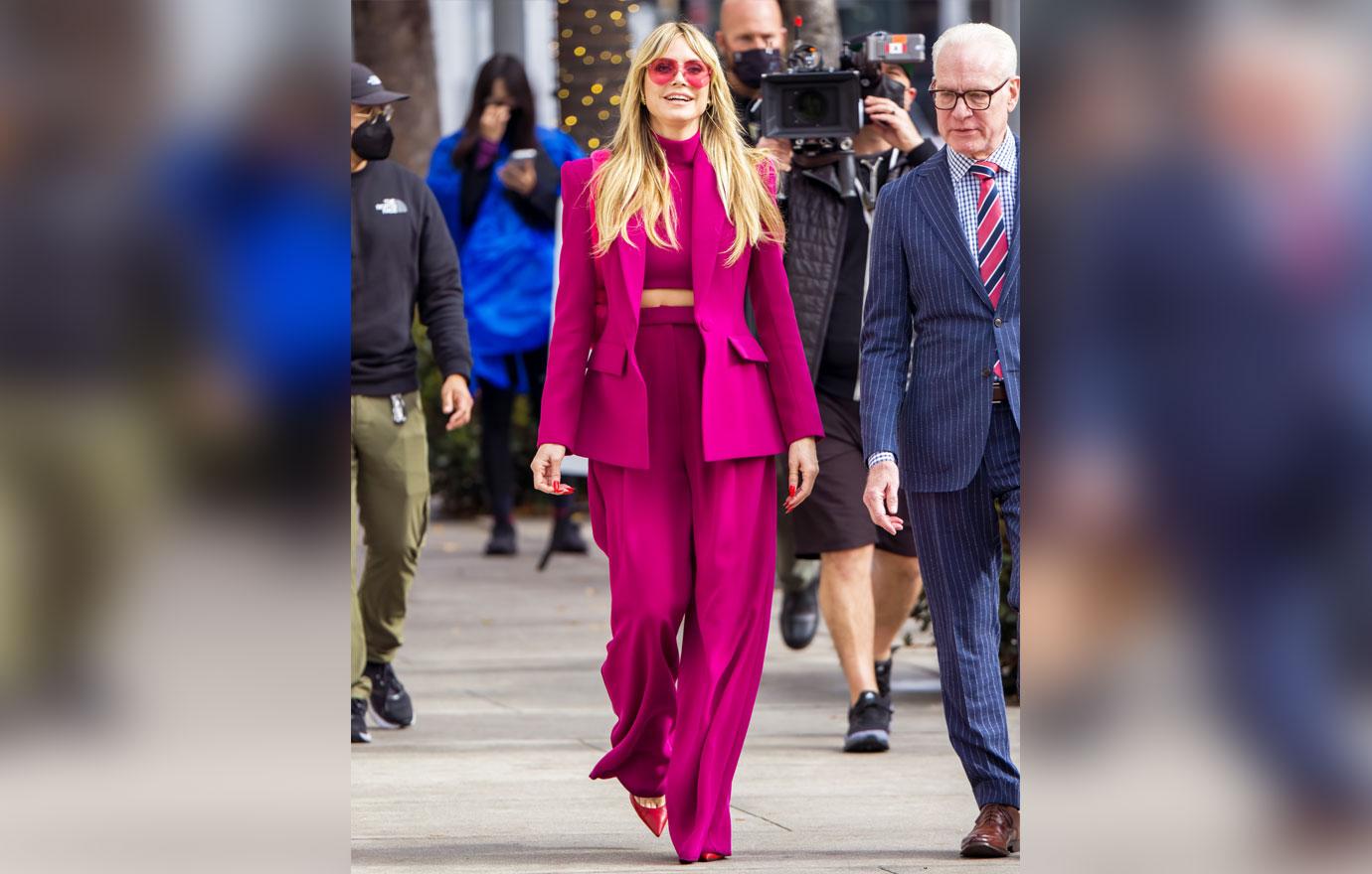 heidi klum flashes toned figure in hot pink suit during filming session with tim gunn on rodeo drive in la