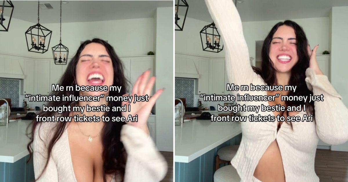Mia Monroe laughs excitedly in a kitchen while wearing a beige top with a plunging neckline