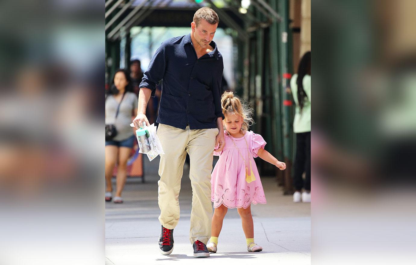 Bradley Cooper sweetly holds hands with daughter Lea, 6, as they enjoy an  after-school ice cream run in NYC