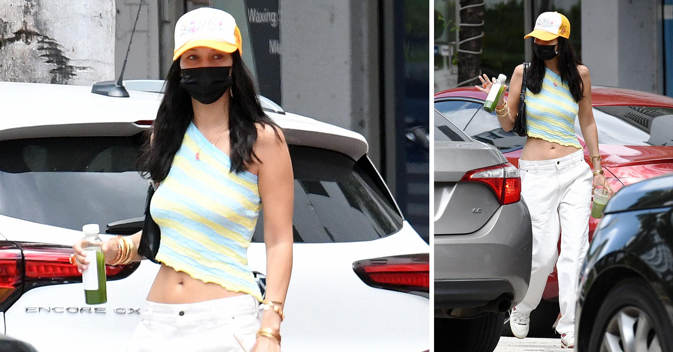 bella hadid wearing crop top and trucker hat mhf