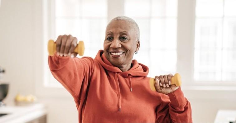 Photo of a woman lifting weights. 