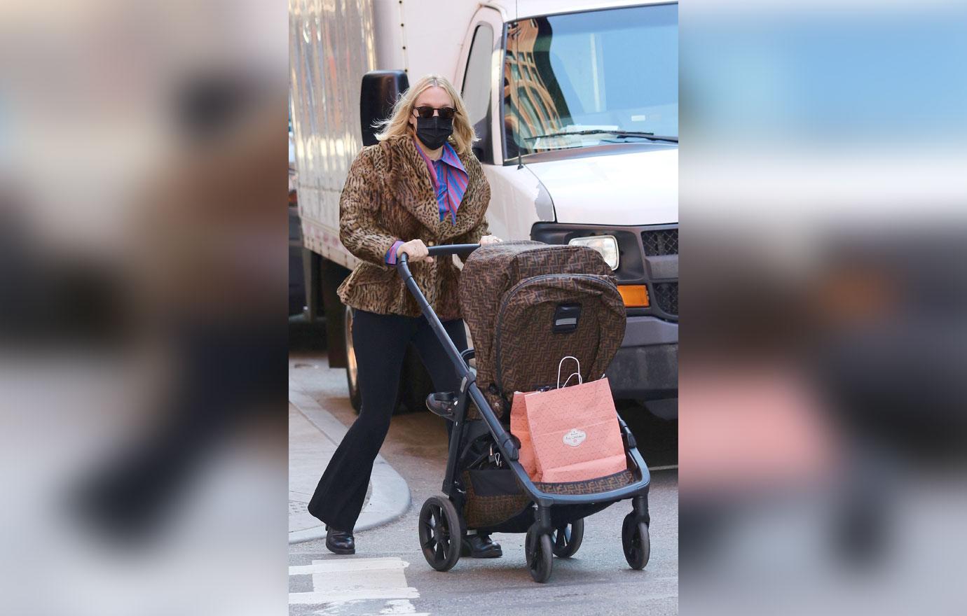 chloe sevigny out in leopard coat and fendi stroller