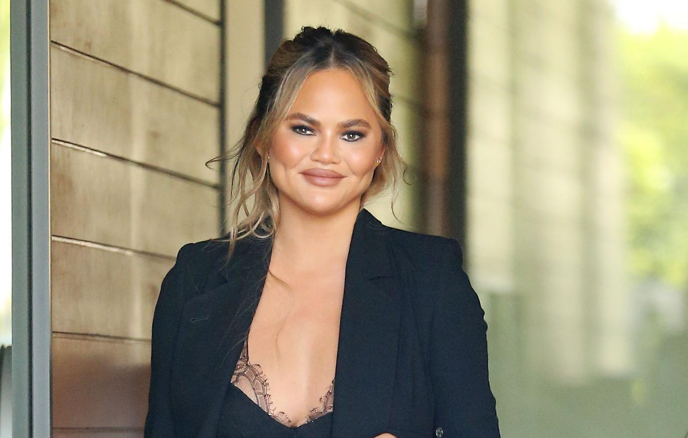 chrissy teigen makeup half face selfie