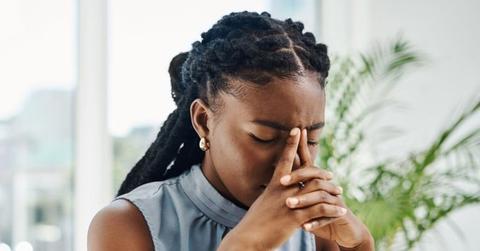 Photo of someone with a headache.