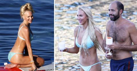 christine quinn practicing yoga on a board