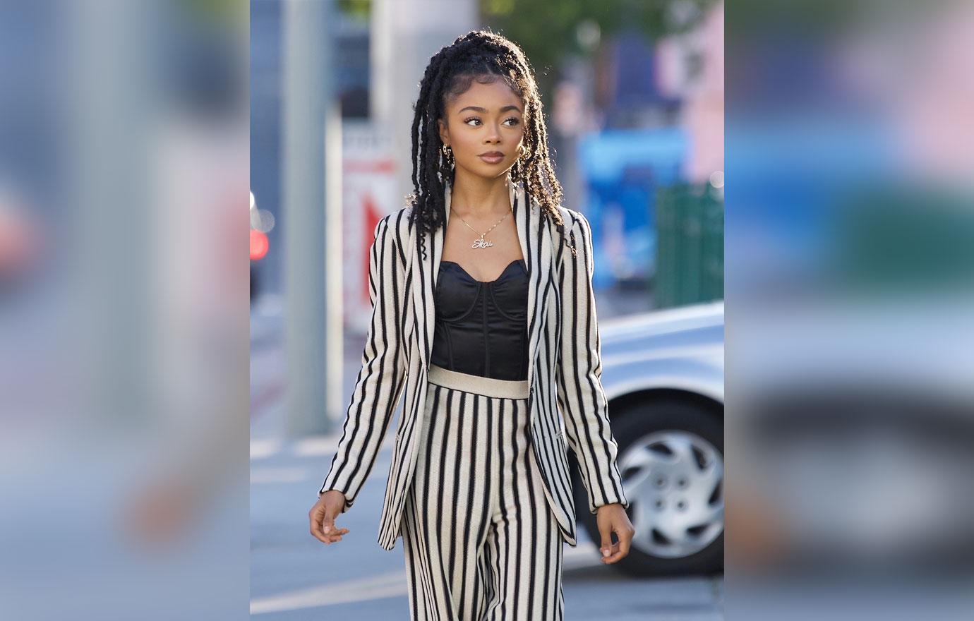 skai jackson steps out in striped pant suit