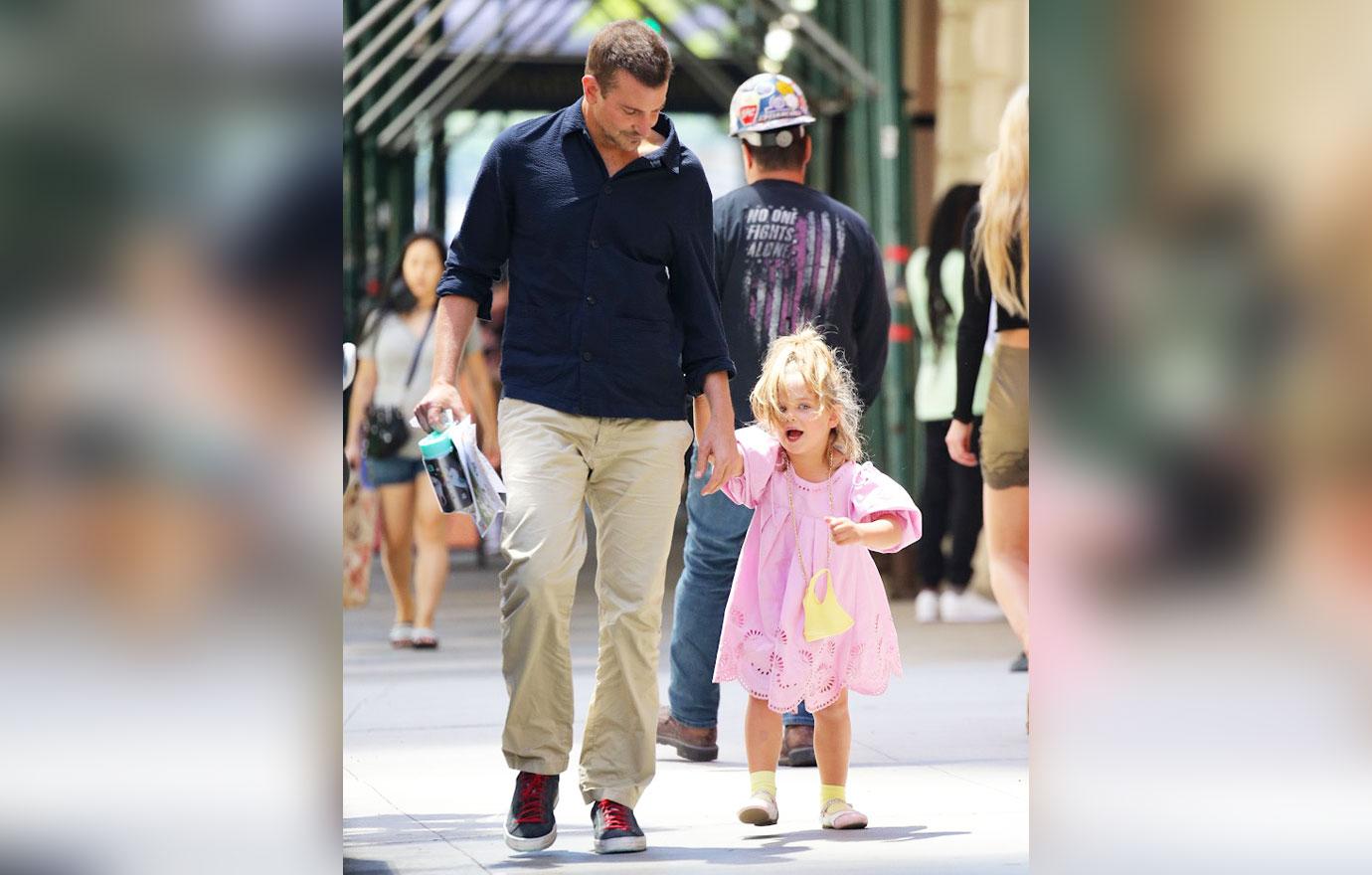 Bradley Cooper, 47, is a doting father as he holds hands with his  five-year-old daughter Lea in NYC