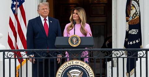 Melania Trump making a speech while President Donald Trump listens.