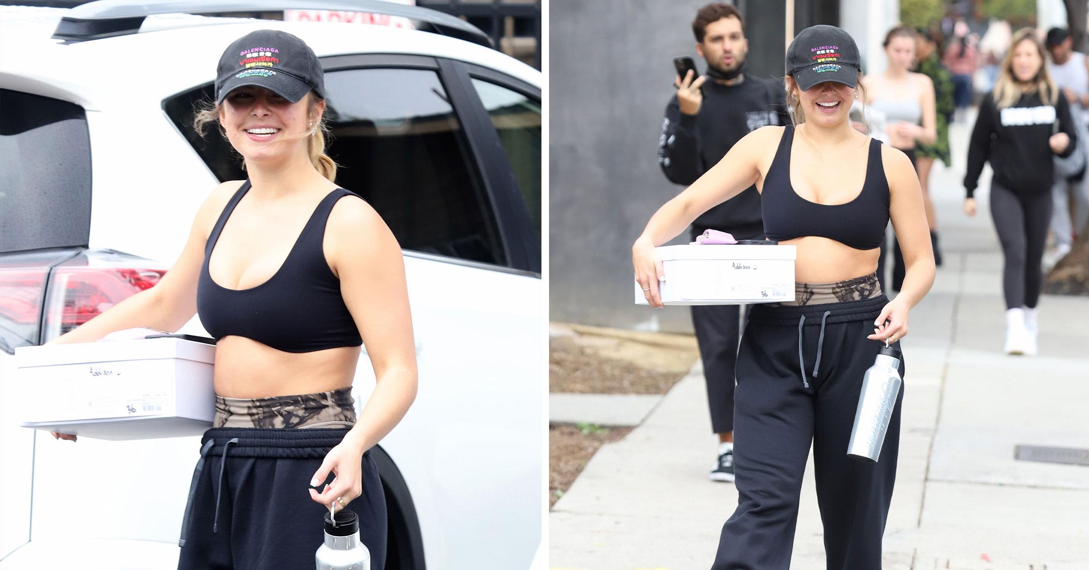 addison rae looks fit in a black sports bra and leggings while