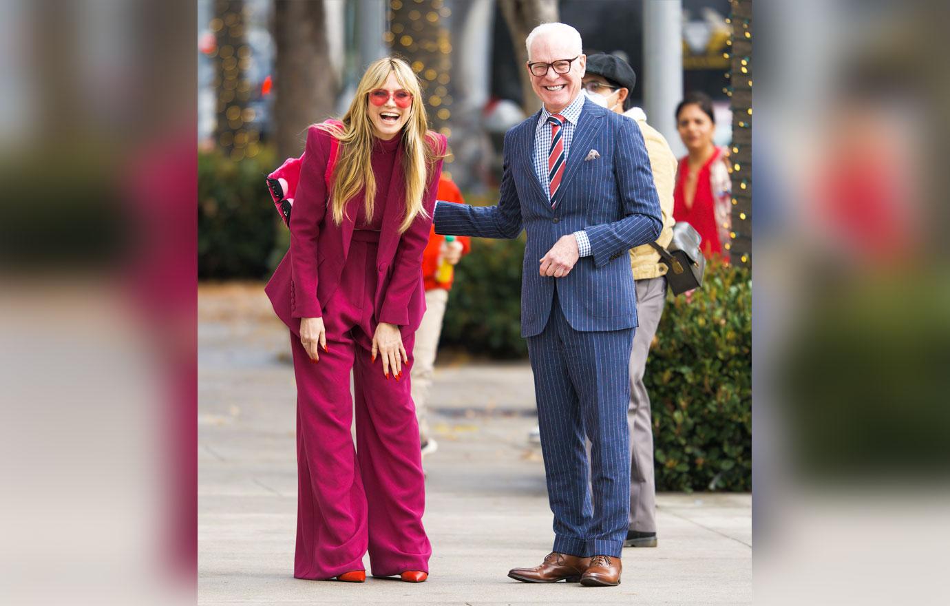 heidi klum flashes toned figure in hot pink suit during filming session with tim gunn on rodeo drive in la