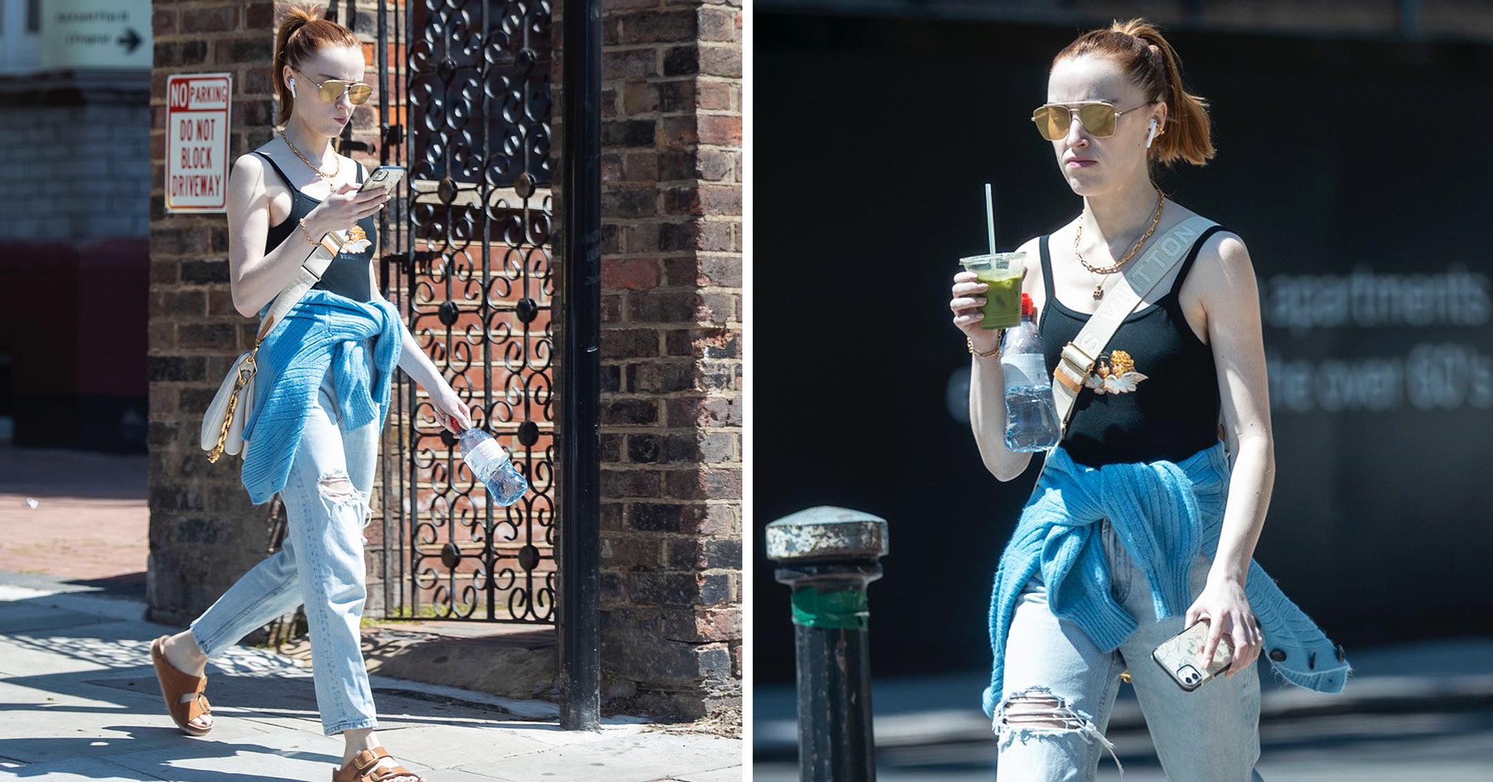 phoebe dynevor seen going for a walk on a sunny day in london wearing a crop top and jeans