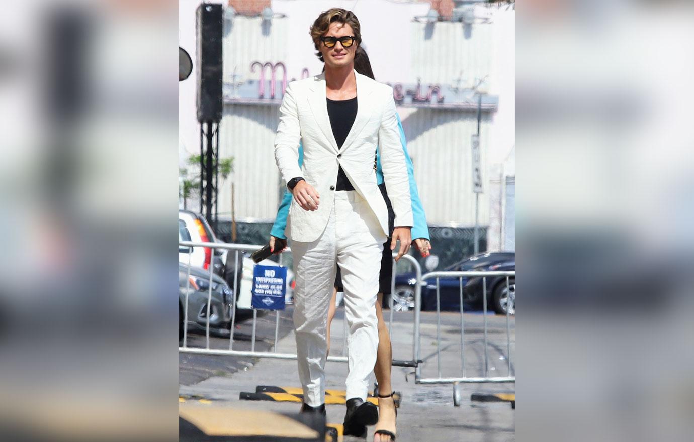 chase stokes arriving at jimmy kimmel live white suit