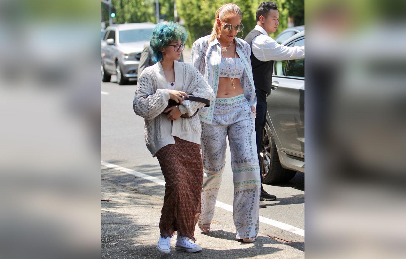 jennifer lopez attends the jennifer klein day of indulgence event with daughter emma showing off her toned abs