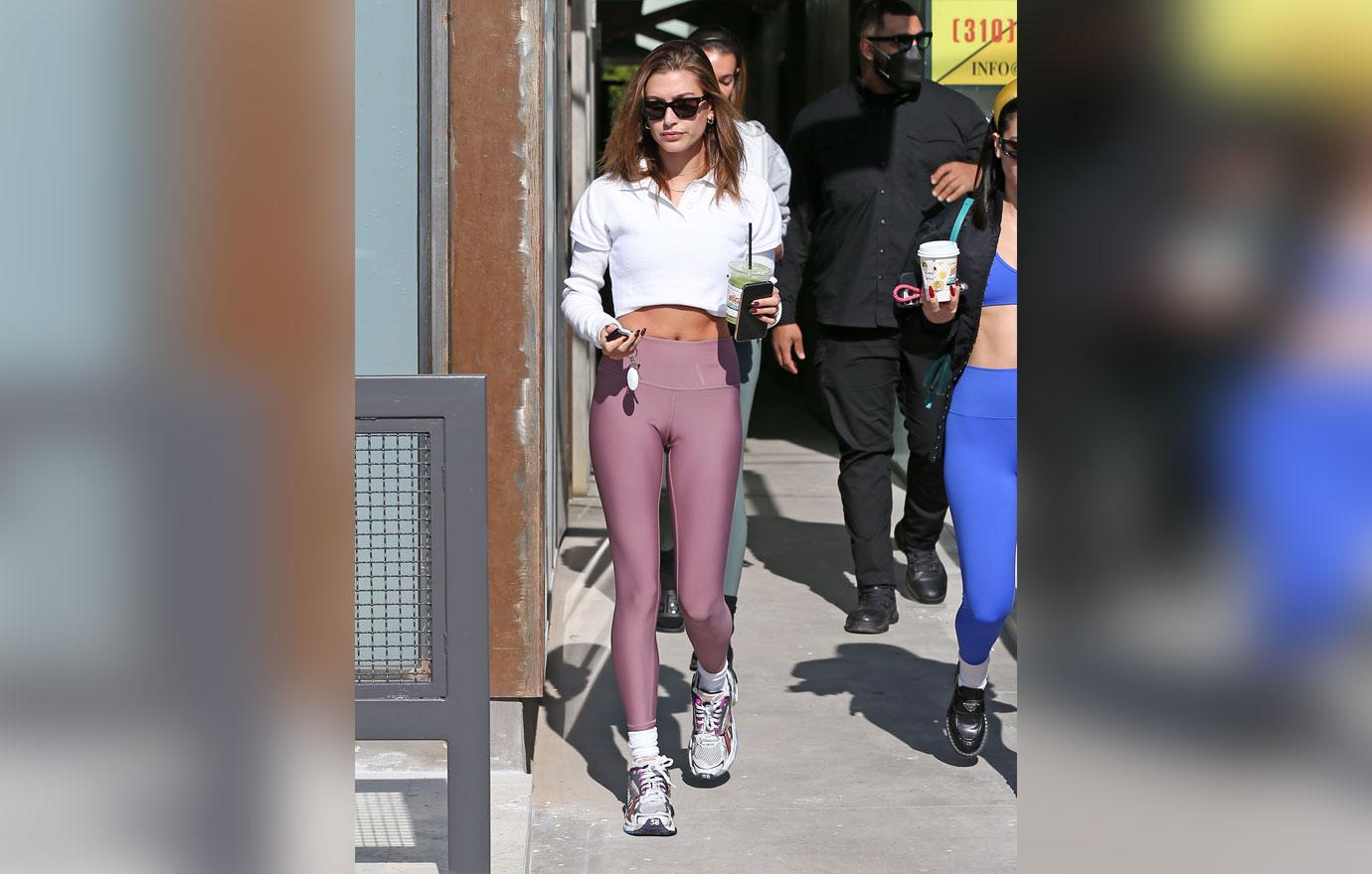 Hailey Baldwin Wears A Cropped Polo Shirt & Mauve Leggings: Pics