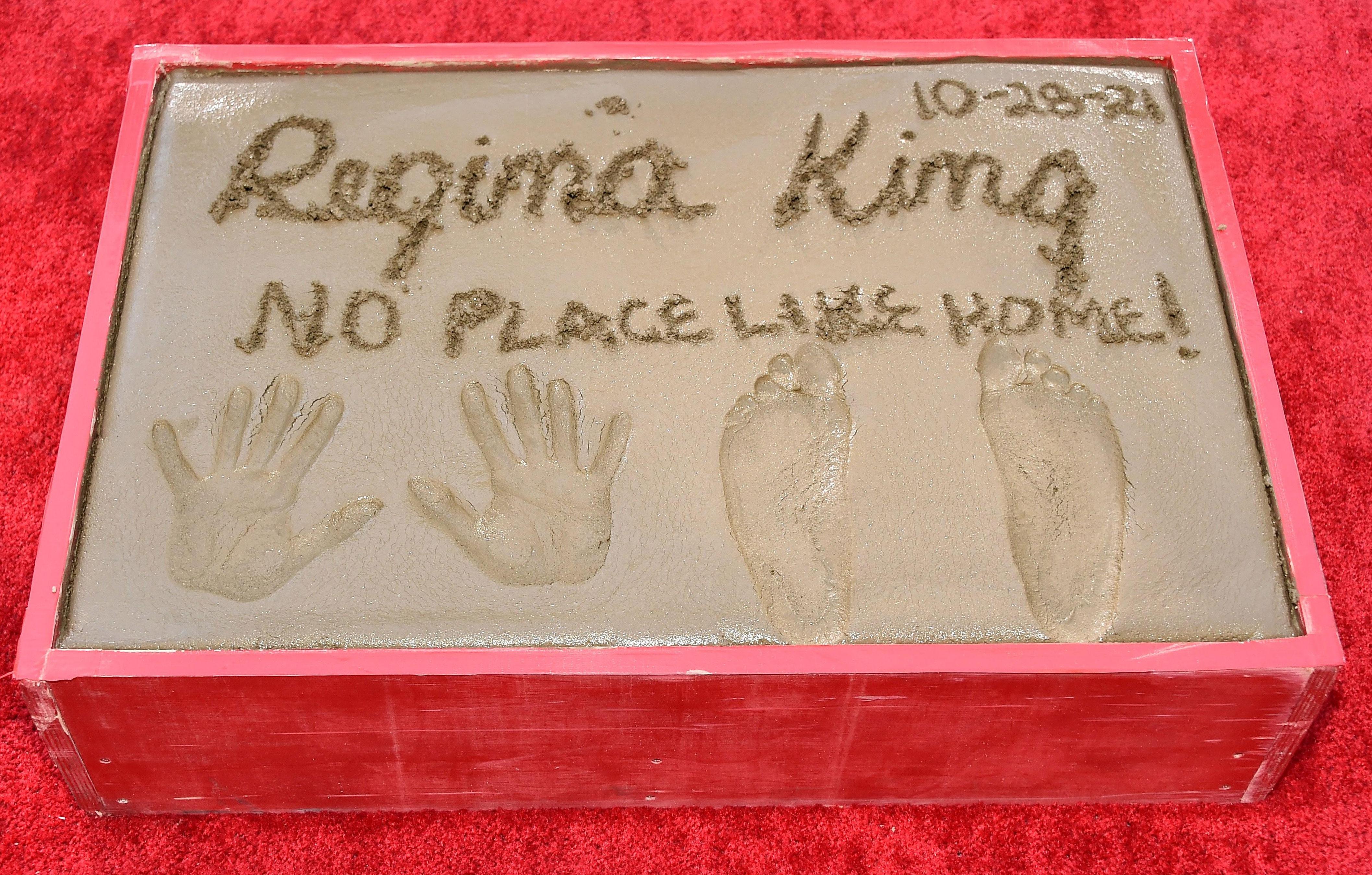 regina king handprints and footprints ceremony at the tcl chinese theatre