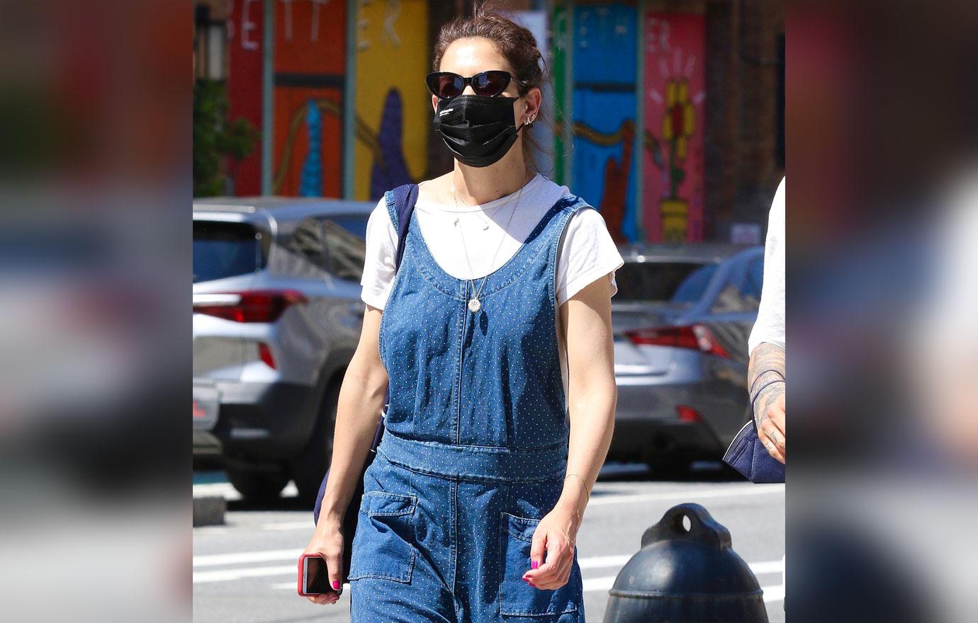 katie holmes steps out in blue overalls in  degree weather in nyc