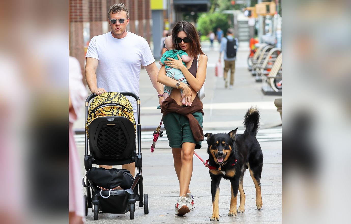 emily ratajkowski is all smiling while carrying her baby as they taking a stroll with husband sebastian bear mcclard in nyc