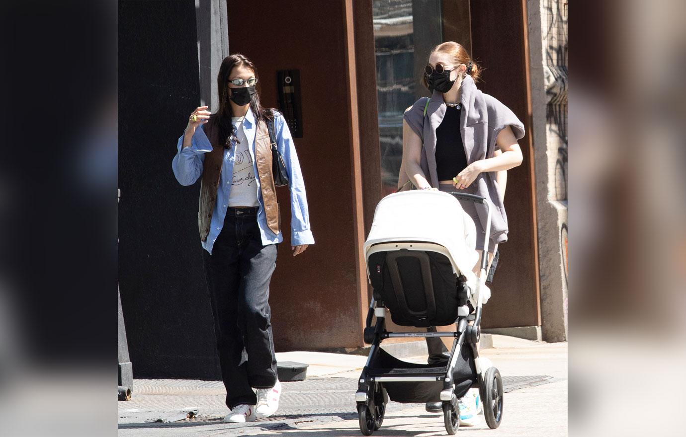 gigi hadid and bella hadid take baby khai for a walk