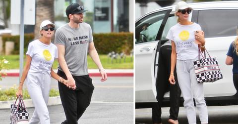tarek el moussa and heather rae young picking up frozen yogurt with tareks daughter