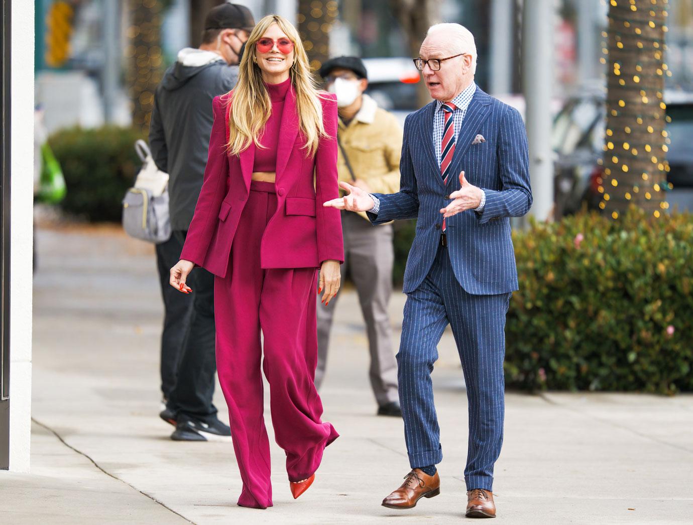 heidi klum flashes toned figure in hot pink suit during filming session with tim gunn on rodeo drive in la