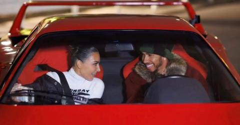 Kim Kardashian and Lewis Hamilton posing for a photo
