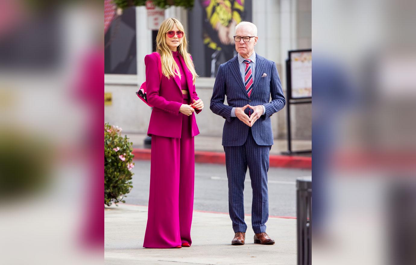 heidi klum flashes toned figure in hot pink suit during filming session with tim gunn on rodeo drive in la