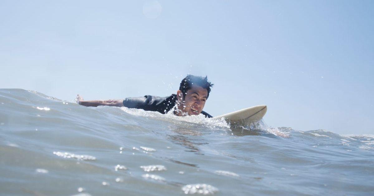 Representational image of a male surfer