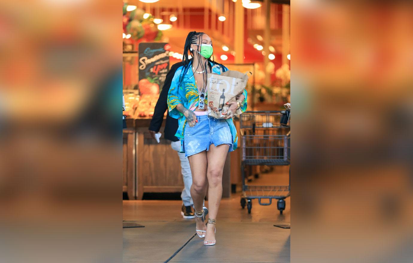 rihanna wears a bright outfit as she picks up groceries