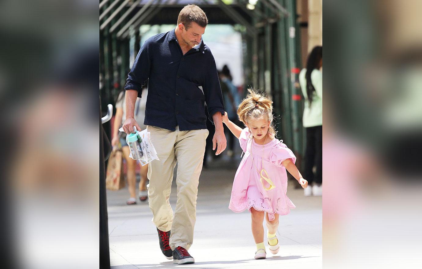 Bradley Cooper, 47, is a doting father as he holds hands with his  five-year-old daughter Lea in NYC