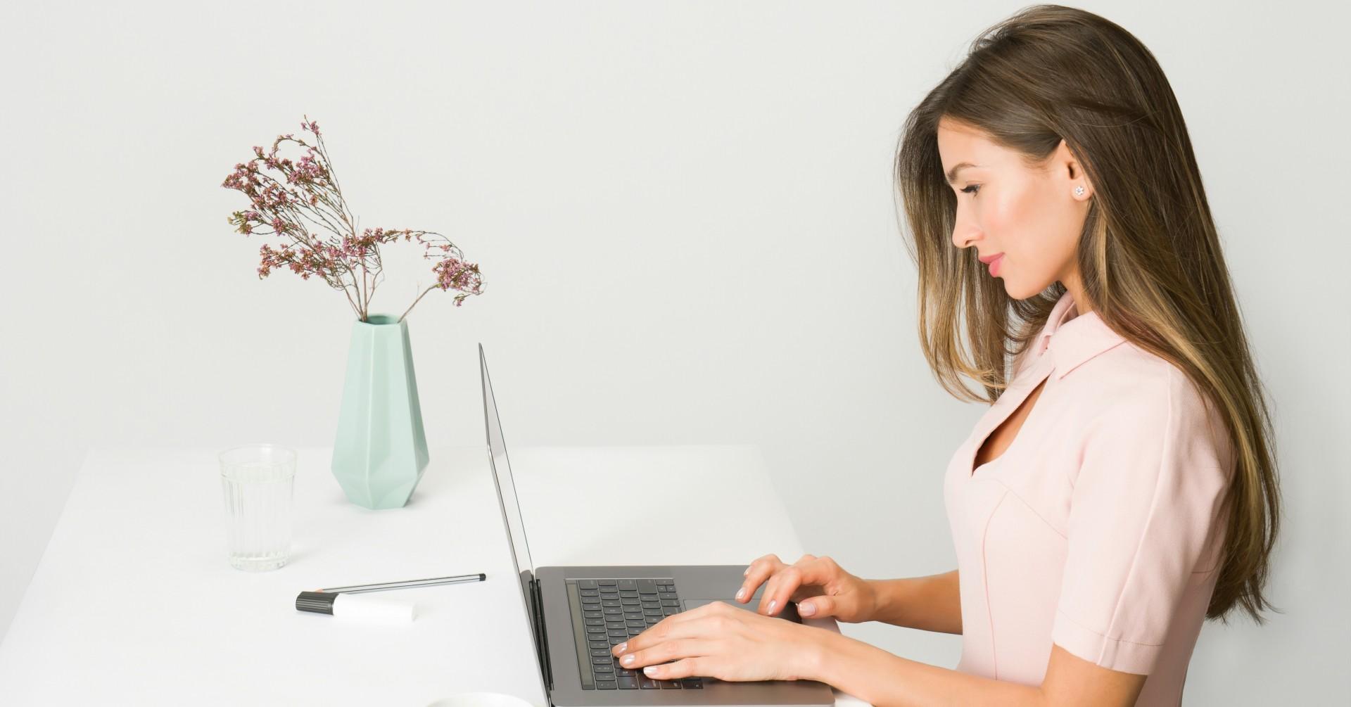 Photo of someone working at a desk. 