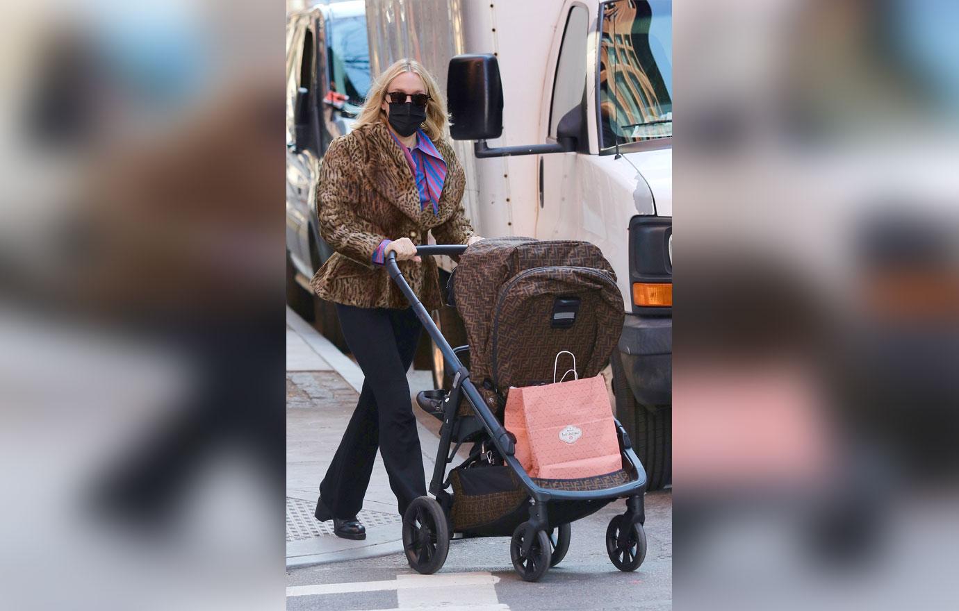 chloe sevigny out in leopard coat and fendi stroller