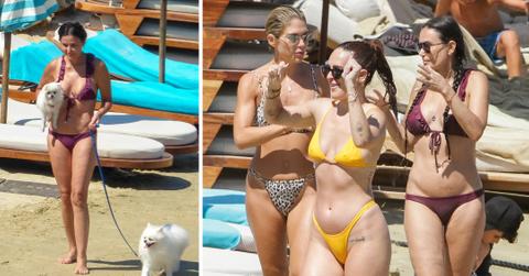 demi moore and daughters on beach in greece