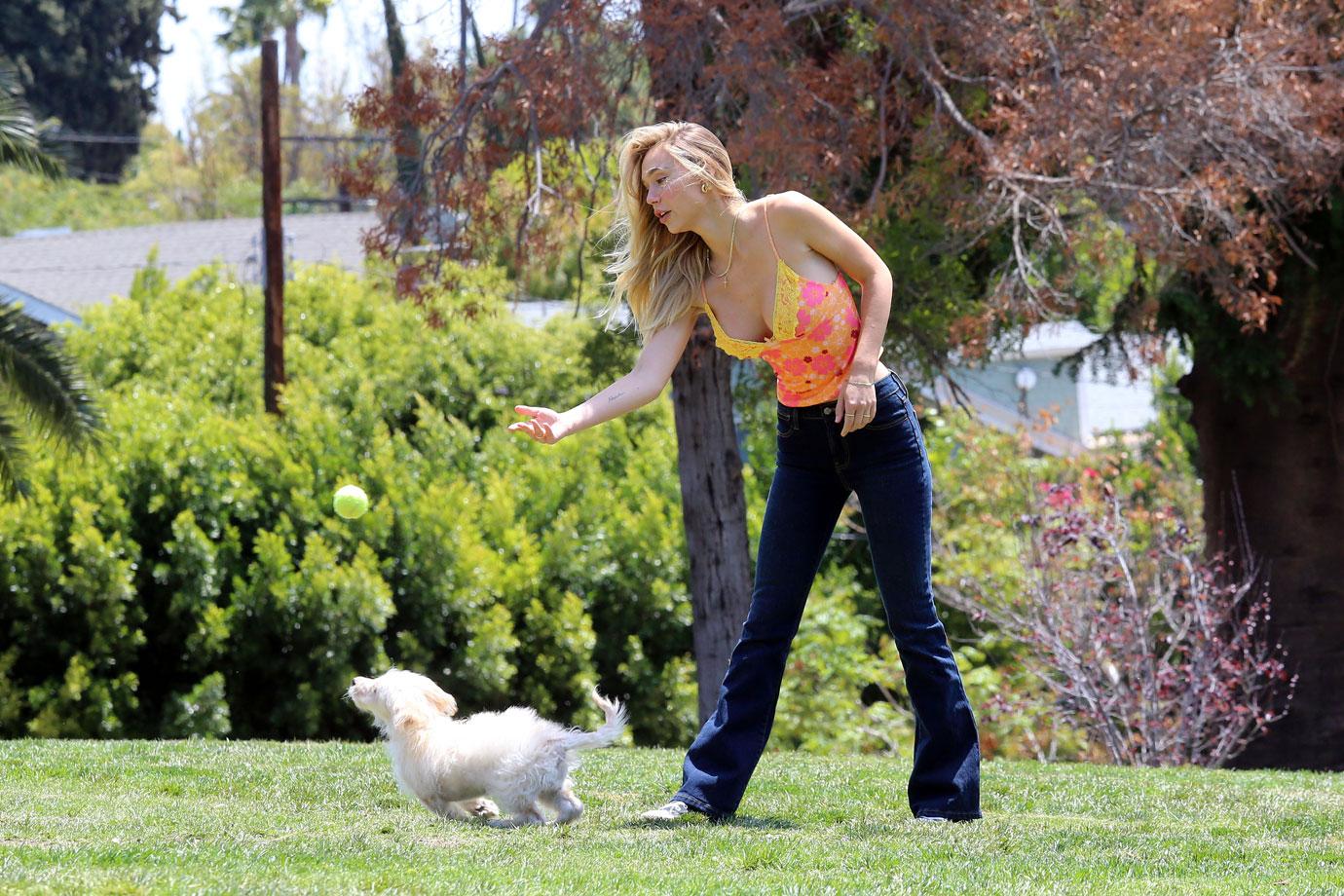 alexis ren in the park with her dog angel