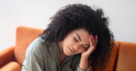 Photo of someone with a headache.