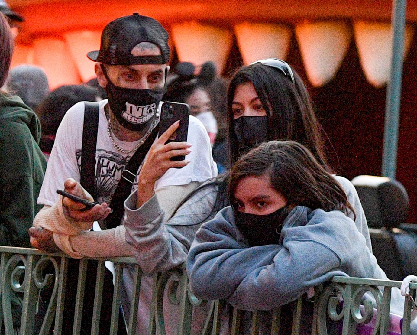 kourtney kardashian and travis barker take their modern family on a fun day out at disneyland