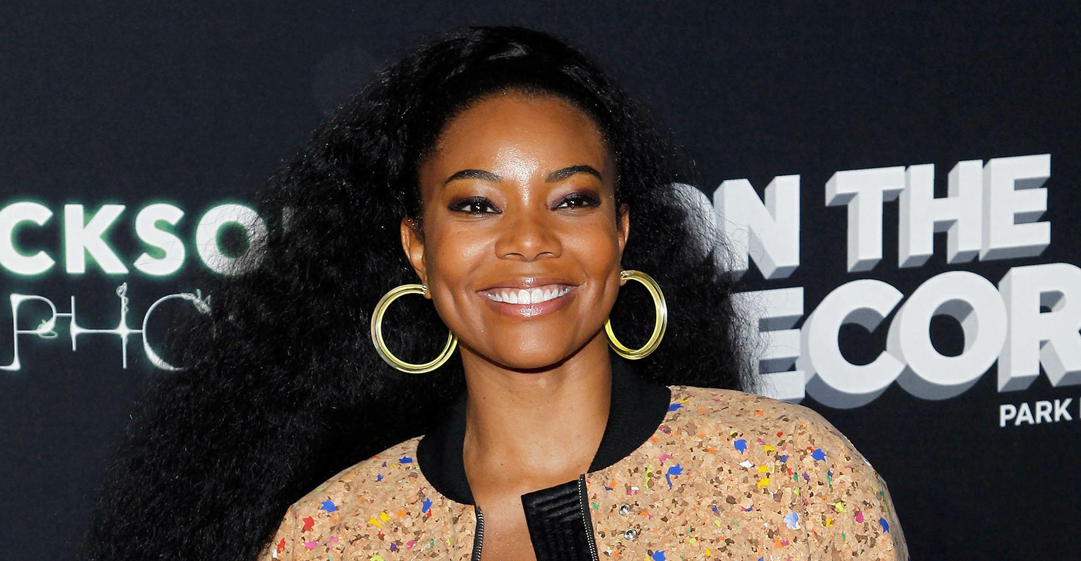 gabrielle union embracing natural curly hair