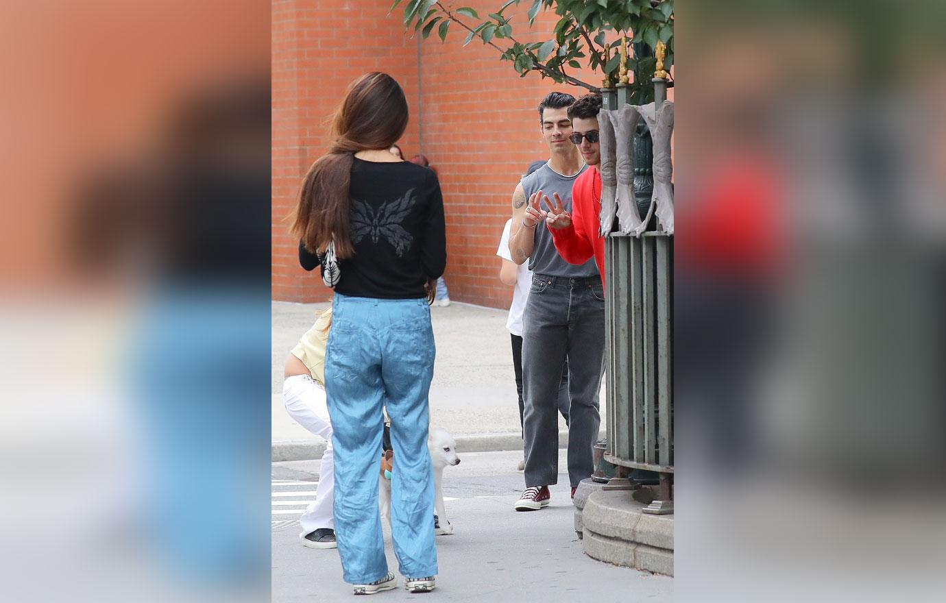 nick and joe jonas walking around tribeca