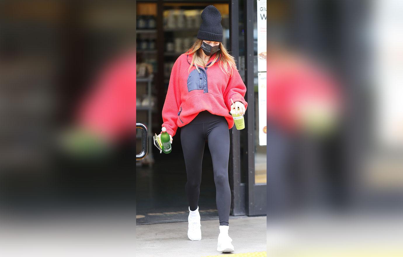 Hailey Bieber flaunts her street style in leggings and crewneck sweater