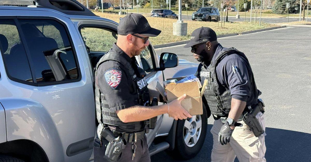 Image of Officers from Arapahoe County Sheriff's Office were able to reunite a lost cats with her owners.